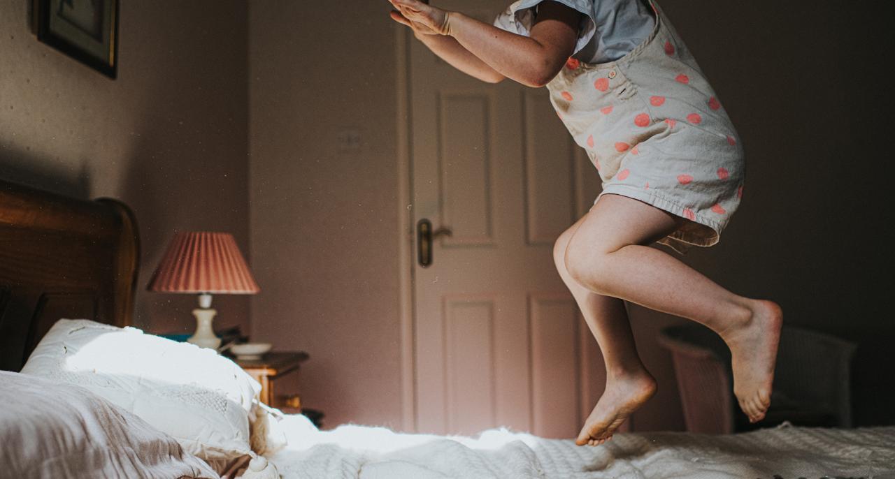 small-child-jumping-on-the-bed